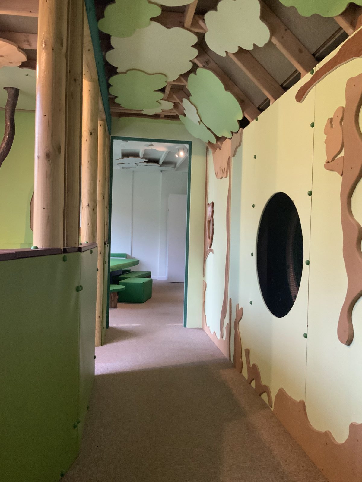 The treehouse corridor leading through the indoor play area